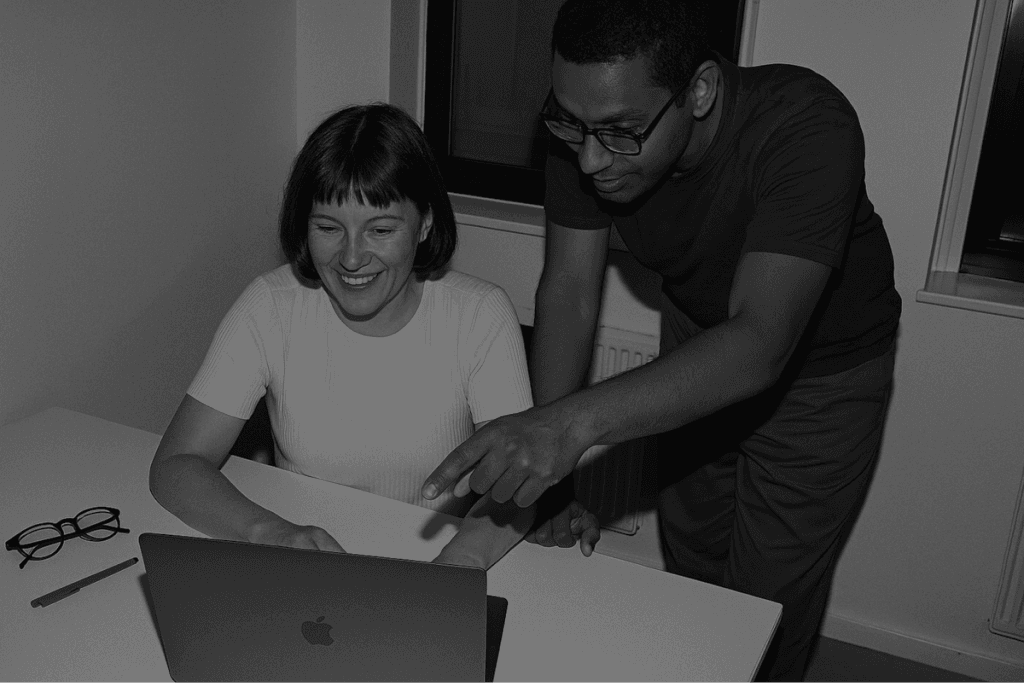 Two Techiebutler engineers working through a problem together at a desk